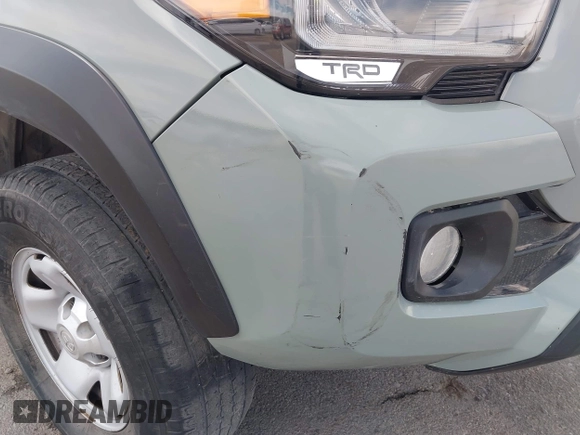 2022 Toyota Tacoma SR with VIN 3TMCZ5AN0NM507320, listed as a IAAI auction lot 42220296 with 33,342 mi miles and . Bid and sale history available at DreamBid. Image 6.