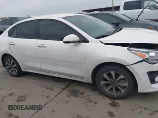 2023 Kia Rio S z VIN 3KPA24AD3PE542301, wystawiony jako IAAI lot #41364553 z przebiegiem 35 204 mil mil oraz . Historia ofert i sprzedaży dostępna na DreamBid. Obrazek 13.