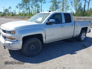 2018 Chevrolet Silverado 1500 LT with VIN 1GCVKREC9JZ335603, listed as a IAAI auction lot 41853399 with 152,460 mi miles and . Bid and sale history available at DreamBid. Image 2.
