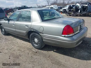 2001 Ford Crown Victoria LX with VIN 2FAFP74W01X102534, listed as a IAAI auction lot 42017605 with 160,063 mi miles. Bid and sale history available at carsss.com. Image 3.