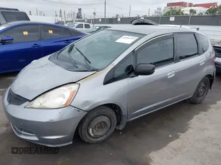 2009 Honda Fit with VIN JHMGE88279S055565, listed as a IAAI auction lot 41896359 with 184,618 mi miles. Bid and sale history available at carsss.com. Image 2.