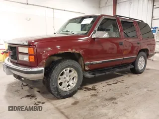 1999 GMC Yukon with VIN 1GKEK13R3XJ700930, listed as a IAAI auction lot 40915481 with 249,773 mi miles. Bid and sale history available at carsss.com. Image 2.