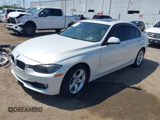 2012 BMW 3 Series 328i with VIN WBA3A5C51CF349987, listed as a IAAI auction lot 42013599 with 256,461 mi miles. Bid and sale history available at carsss.com. Image 2.
