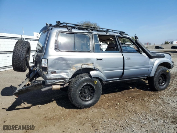 1996 Toyota Land Cruiser with VIN JT3HJ85J0T0145838, listed as a Copart auction lot 77593764 with 158,507 mi miles and Salvage Title. Bid and sale history available at carsss.com. Image 3.