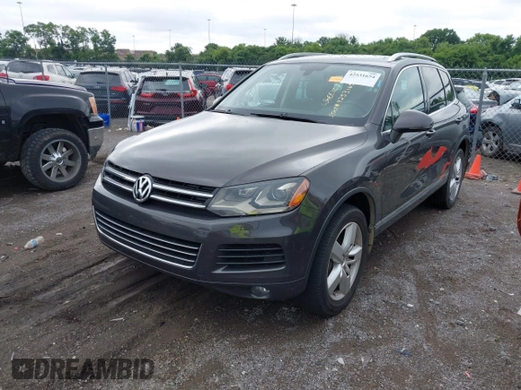 2012 Volkswagen Touareg Sport with VIN WVGFK9BP0CD002939, listed as a IAAI auction lot 42531654 with 222,435 mi miles and . Bid and sale history available at DreamBid. Image 2.