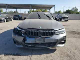 2020 BMW 3 Series 330i z VIN 3MW5R1J00L8B13518, wystawiony jako Copart lot #56289265 z przebiegiem 74 336 mil mil oraz Czysty tytuł • Clean title. Historia ofert i sprzedaży dostępna na DreamBid. Obrazek 5.