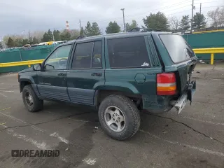 1996 Jeep Grand Cherokee Laredo with VIN 1J4GZ58S6TC165636, listed as a Copart auction lot 51485235 with 266,873 mi miles and Salvage Title. Bid and sale history available at carsss.com. Image 2.