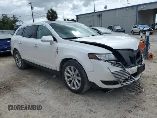 2014 Lincoln MKT with VIN 2LMHJ5FK5EBL57377, listed as a Copart auction lot 70608694 with 115,053 mi miles and Salvage Title. Bid and sale history available at DreamBid. Image 4.
