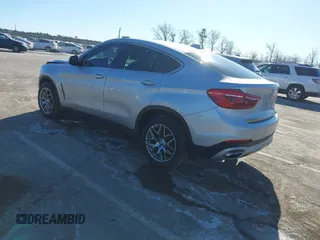 2018 BMW X6 xDrive35i with VIN 5UXKU2C50J0X51275, listed as a IAAI auction lot 41421704 with 165,052 mi miles. Bid and sale history available at carsss.com. Image 3.