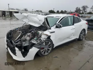 2016 Kia Optima SX Turbo with VIN 5XXGW4L21GG085716, listed as a Copart auction lot 43647205 with 184,554 mi miles and Salvage title. Bid and sale history available at DreamBid. Image 1.