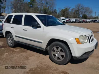 2008 Jeep Grand Cherokee Laredo with VIN 1J8GS48K88C121433, listed as a IAAI auction lot 41762486 with 303,078 mi miles. Bid and sale history available at carsss.com. Image 1.