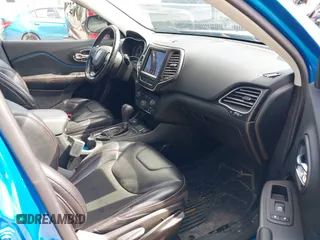 2020 Jeep Cherokee Trailhawk with VIN 1C4PJMBXXLD636547, listed as a IAAI auction lot 42314654 with 59,061 mi miles and . Bid and sale history available at DreamBid. Image 5.