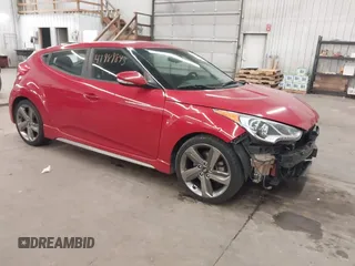 2013 Hyundai Veloster Turbo z VIN KMHTC6AE2DU106686, wystawiony jako IAAI lot #41989843 z przebiegiem 138 205 mil mil oraz . Historia ofert i sprzedaży dostępna na DreamBid. Obrazek 1.