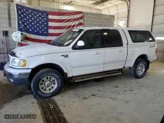 2001 Ford F-150 SuperCrew XLT with VIN 1FTRW08L21KE03150, listed as a Copart auction lot 67372004 with 184,124 mi miles and Salvage Title. Bid and sale history available at carsss.com. Image 1.