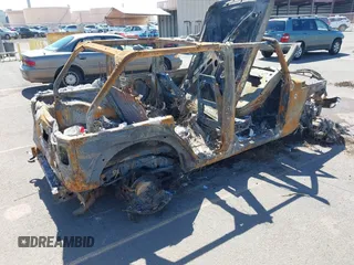 2015 Jeep Wrangler Unlimited Willys Wheeler with VIN 1C4BJWDG0FL751574, listed as a IAAI auction lot 41604064 with Not Provided miles and . Bid and sale history available at DreamBid. Image 4.