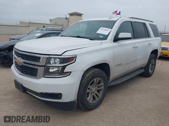2015 Chevrolet Tahoe LS with VIN 1GNSCAEC2FR641252, listed as a IAAI auction lot 41528667 with 183,796 mi miles and . Bid and sale history available at DreamBid. Image 2.