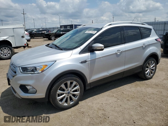 2018 Ford Escape Titanium with VIN 1FMCU9J99JUC89677, listed as a Copart auction lot 60421545 with 98,021 mi miles and Salvage title. Bid and sale history available at DreamBid. Image 1.