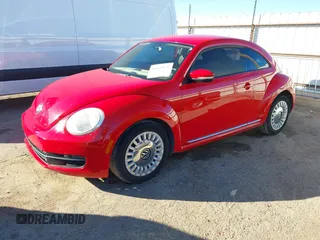 2013 Volkswagen Beetle with VIN 3VWHX7AT3DM682758, listed as a IAAI auction lot 40869170 with 88,793 mi miles and . Bid and sale history available at DreamBid. Image 2.