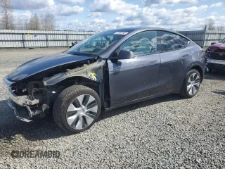 2023 Tesla Model Y Long Range z VIN 7SAYGDEE0PF834570, wystawiony jako Copart lot #51500195 z przebiegiem 18 157 mil mil oraz Szkoda całkowita • Salvage title. Historia ofert i sprzedaży dostępna na DreamBid. Obrazek 1.