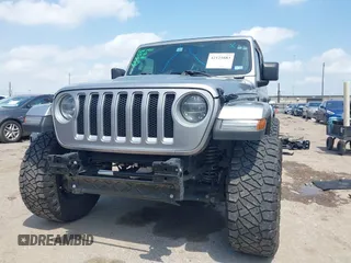 2021 Jeep Wrangler Unlimited High Altitude with VIN 1C4HJXEG3MW511185, listed as a IAAI auction lot 42125883 with 45,564 mi miles and . Bid and sale history available at DreamBid. Image 6.