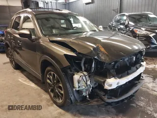 2016 Mazda CX-5 Grand Touring with VIN JM3KE4DYXG0901220, listed as a IAAI auction lot 41858535 with 80,734 mi miles. Bid and sale history available at carsss.com. Image 1.