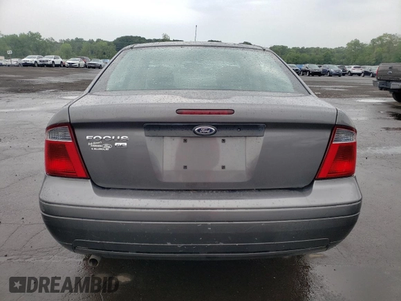 2007 Ford Focus S z VIN 1FAHP34N07W177912, wystawiony jako Copart lot #60481025 z przebiegiem 114 086 mil mil oraz Szkoda całkowita • Salvage title. Historia ofert i sprzedaży dostępna na DreamBid. Obrazek 6.