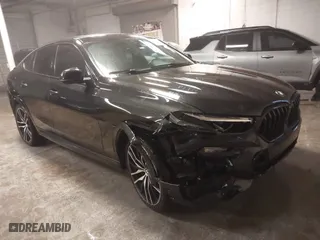 2021 BMW X6 xDrive40i with VIN 5UXCY6C03M9E61703, listed as a IAAI auction lot 41602401 with 1 mi miles. Bid and sale history available at carsss.com. Image 1.