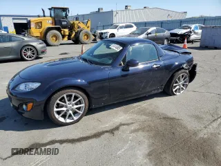 2009 Mazda MX-5 Miata Grand Touring with VIN JM1NC26F790203775, listed as a Copart auction lot 61414805 with 111,850 mi miles and Salvage title. Bid and sale history available at DreamBid. Image 1.