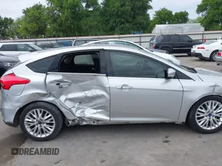2015 Ford Focus Titanium with VIN 1FADP3N23FL356822, listed as a IAAI auction lot 41981053 with 115,584 mi miles and . Bid and sale history available at DreamBid. Image 14.