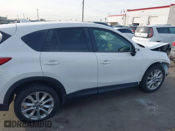 2015 Mazda CX-5 Grand Touring with VIN JM3KE4DY3F0483629, listed as a IAAI auction lot 41054059 with 118,980 mi miles. Bid and sale history available at carsss.com. Image 12.