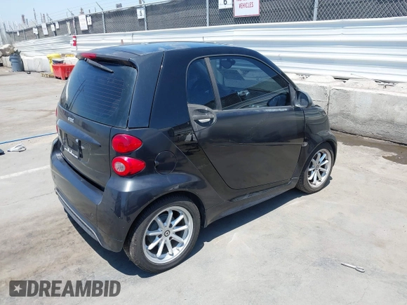 2014 Smart fortwo Pure with VIN WMEEJ3BA1EK752202, listed as a IAAI auction lot 42672207 with 65,736 mi miles and . Bid and sale history available at DreamBid. Image 4.