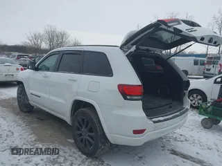2018 Jeep Grand Cherokee Laredo E with VIN 1C4RJFAG1JC499457, listed as a IAAI auction lot 41379459 with 127,344 mi miles and . Bid and sale history available at DreamBid. Image 3.