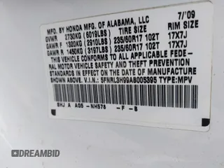 2010 Honda Odyssey Touring with VIN 5FNRL3H99AB005395, listed as a IAAI auction lot 42027445 with 181,559 mi miles. Bid and sale history available at carsss.com. Image 9.