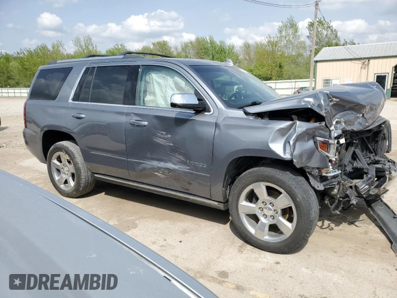 2020 Chevrolet Tahoe Premier with VIN 1GNSKCKC7LR125399, listed as a Copart auction lot 54702635 with 134,684 mi miles and Salvage title. Bid and sale history available at DreamBid. Image 4.