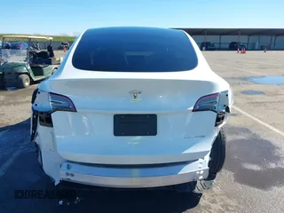 2023 Tesla Model Y Long Range with VIN 7SAYGDEE0PF945202, listed as a IAAI auction lot 41611762 with 7,316 mi miles and . Bid and sale history available at DreamBid. Image 16.