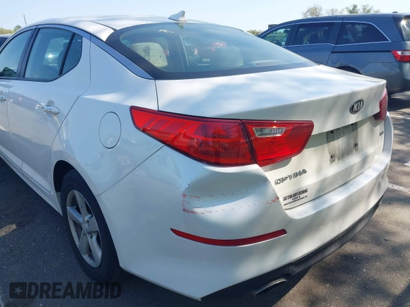 2015 Kia Optima LX with VIN KNAGM4A76F5663782, listed as a IAAI auction lot 42162942 with 128,321 mi miles. Bid and sale history available at carsss.com. Image 6.
