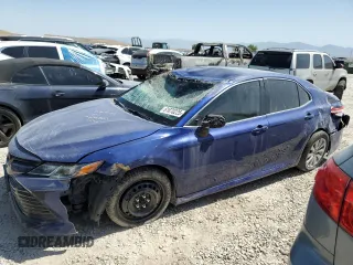 2018 Toyota Camry LE with VIN JTNB11HK0J3043542, listed as a Copart auction lot 61870225 with 105,277 mi miles and Clean title. Bid and sale history available at DreamBid. Image 1.