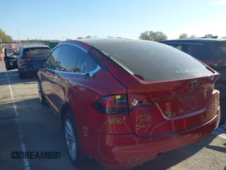 2020 Tesla Model X Long Range with VIN 5YJXCDE22LF217014, listed as a IAAI auction lot 41845824 with 149,375 mi miles and . Bid and sale history available at DreamBid. Image 3.