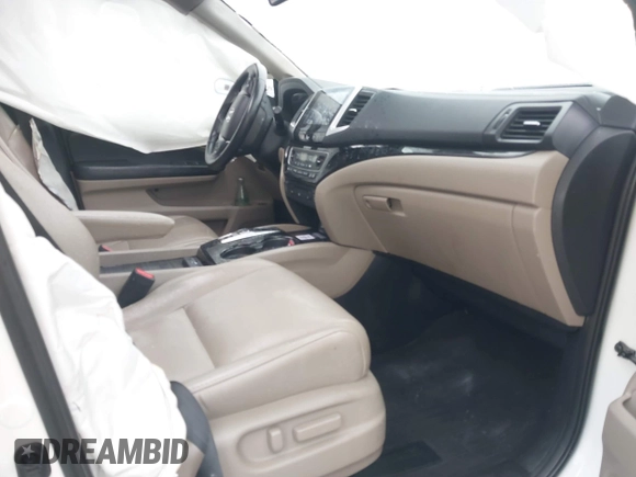 2016 Honda Pilot Touring with VIN 5FNYF6H95GB062089, listed as a IAAI auction lot 41810378 with 74,704 mi miles and . Bid and sale history available at DreamBid. Image 5.