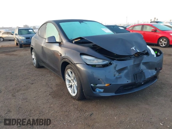 2021 Tesla Model Y Standard Range z VIN 5YJYGDED4MF121963, wystawiony jako IAAI lot #41490477 z przebiegiem 41 941 mil mil oraz . Historia ofert i sprzedaży dostępna na DreamBid. Obrazek 1.