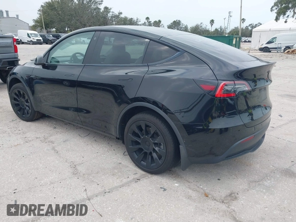 2021 Tesla Model Y Standard Range with VIN 5YJYGDED8MF123246, listed as a IAAI auction lot 41291676 with 74,630 mi miles and . Bid and sale history available at DreamBid. Image 3.