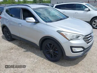 2013 Hyundai Santa Fe Sport z VIN 5XYZUDLA8DG055576, wystawiony jako IAAI lot #42392636 z przebiegiem 165 096 mil mil oraz . Historia ofert i sprzedaży dostępna na DreamBid. Obrazek 1.