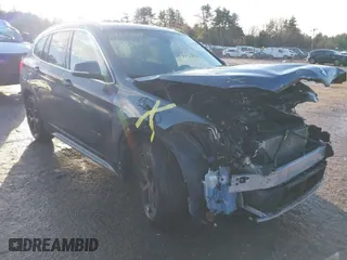 2016 BMW X1 xDrive28i with VIN WBXHT3C30GP881837, listed as a IAAI auction lot 41117389 with 84,157 mi miles. Bid and sale history available at carsss.com. Image 1.