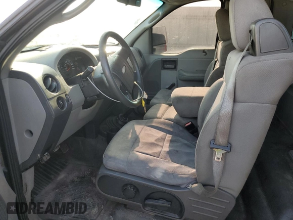2005 Ford F-150 XL with VIN 1FTRF12235NC10435, listed as a Copart auction lot 57311935 with 249,847 mi miles and Salvage title. Bid and sale history available at DreamBid. Image 7.