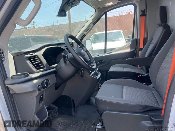 2023 Ford Transit Cargo with VIN 1FTBR1X87PKC09251, listed as a IAAI auction lot 42762766 with 20,509 mi miles and . Bid and sale history available at DreamBid. Image 2.