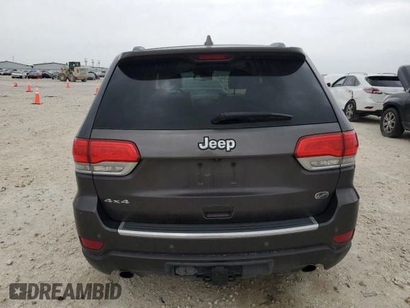 2014 Jeep Grand Cherokee Overland with VIN 1C4RJFCG9EC572237, listed as a Copart auction lot 53864865 with 90,657 mi miles and Salvage Title. Bid and sale history available at DreamBid. Image 6.
