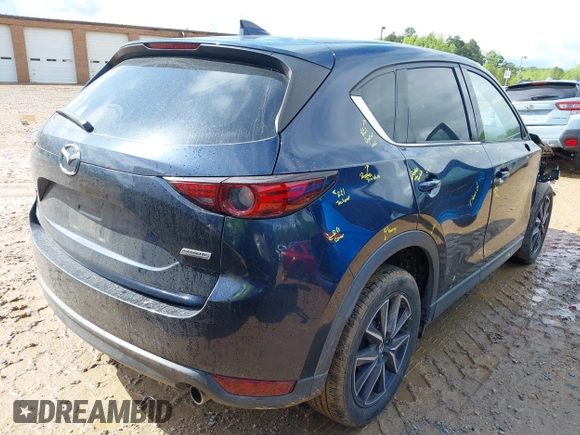 2018 Mazda CX-5 Grand Touring z VIN JM3KFADM8J1406007, wystawiony jako IAAI lot #42008567 z przebiegiem 110 661 mil mil oraz . Historia ofert i sprzedaży dostępna na DreamBid. Obrazek 4.