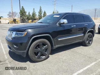 2011 Jeep Grand Cherokee Overland with VIN 1J4RR6GGXBC687048, listed as a Copart auction lot 61684245 with 210,567 mi miles and Salvage title. Bid and sale history available at DreamBid. Image 1.