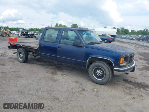 2000 GMC Sierra 3500 z VIN 1GTGC33R1YF502154, wystawiony jako IAAI lot #42183662 z przebiegiem 157 504 mil mil oraz . Historia ofert i sprzedaży dostępna na DreamBid. Obrazek 1.