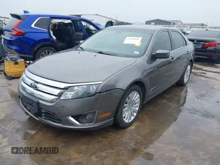 2012 Ford Fusion Hybrid z VIN 3FADP0L33CR289548, wystawiony jako IAAI lot #41905806 z przebiegiem 121 233 mil mil oraz . Historia ofert i sprzedaży dostępna na DreamBid. Obrazek 22.